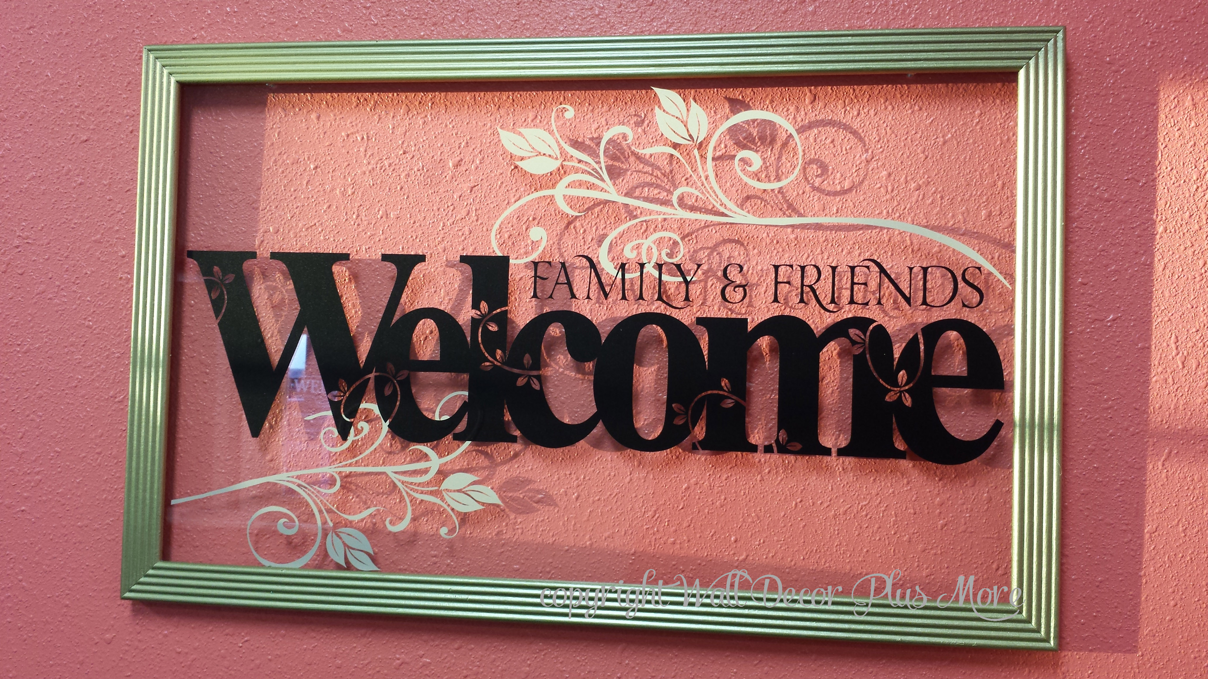 Florals decorate the glass of floating frame along with Welcome lettering